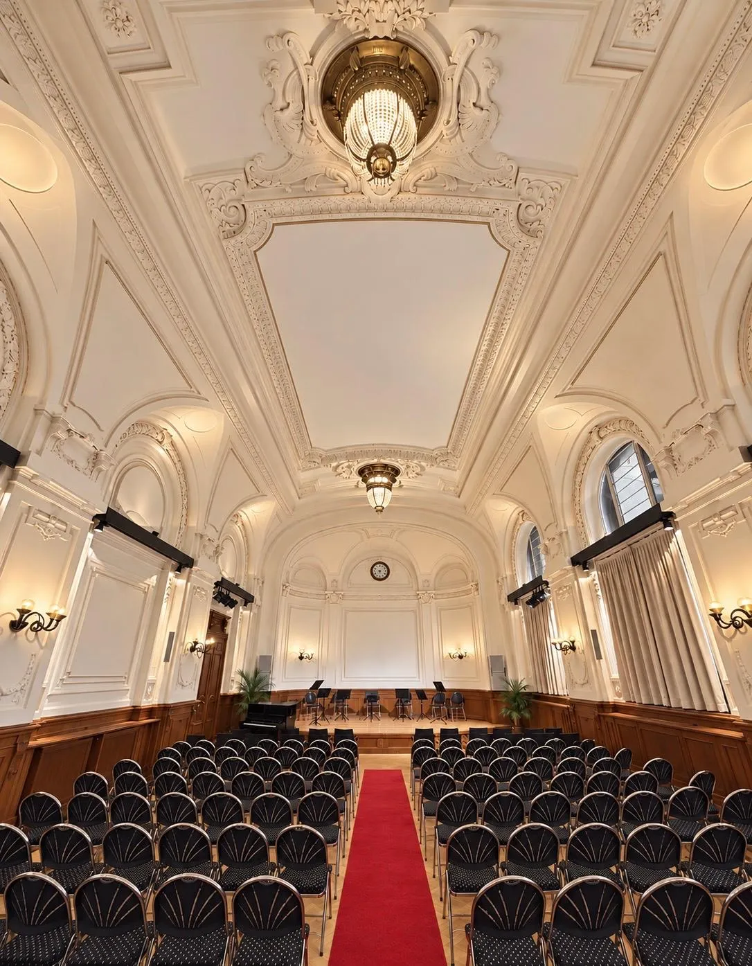 View across the rows of seats to the stage of the Albert Hall