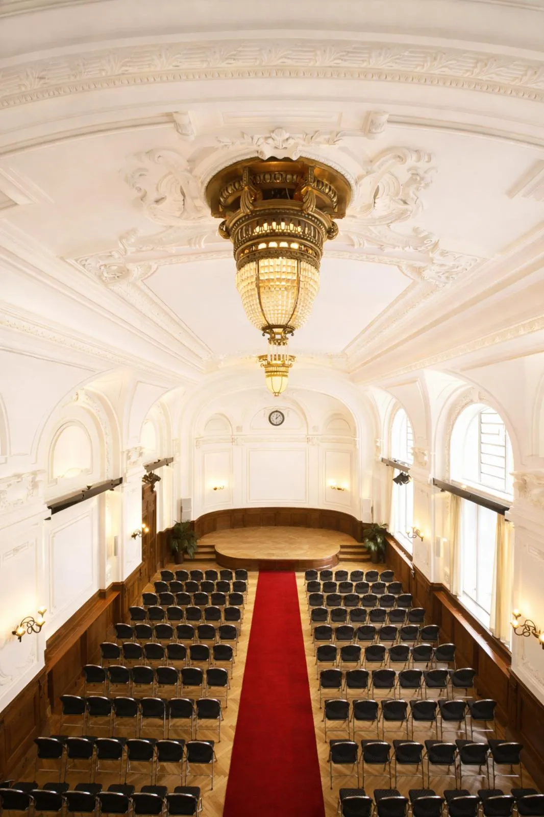 Concert hall of the Albert Hall with chandelier and stucco ceiling
